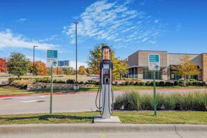 Electric vehicle charging station available for guests.