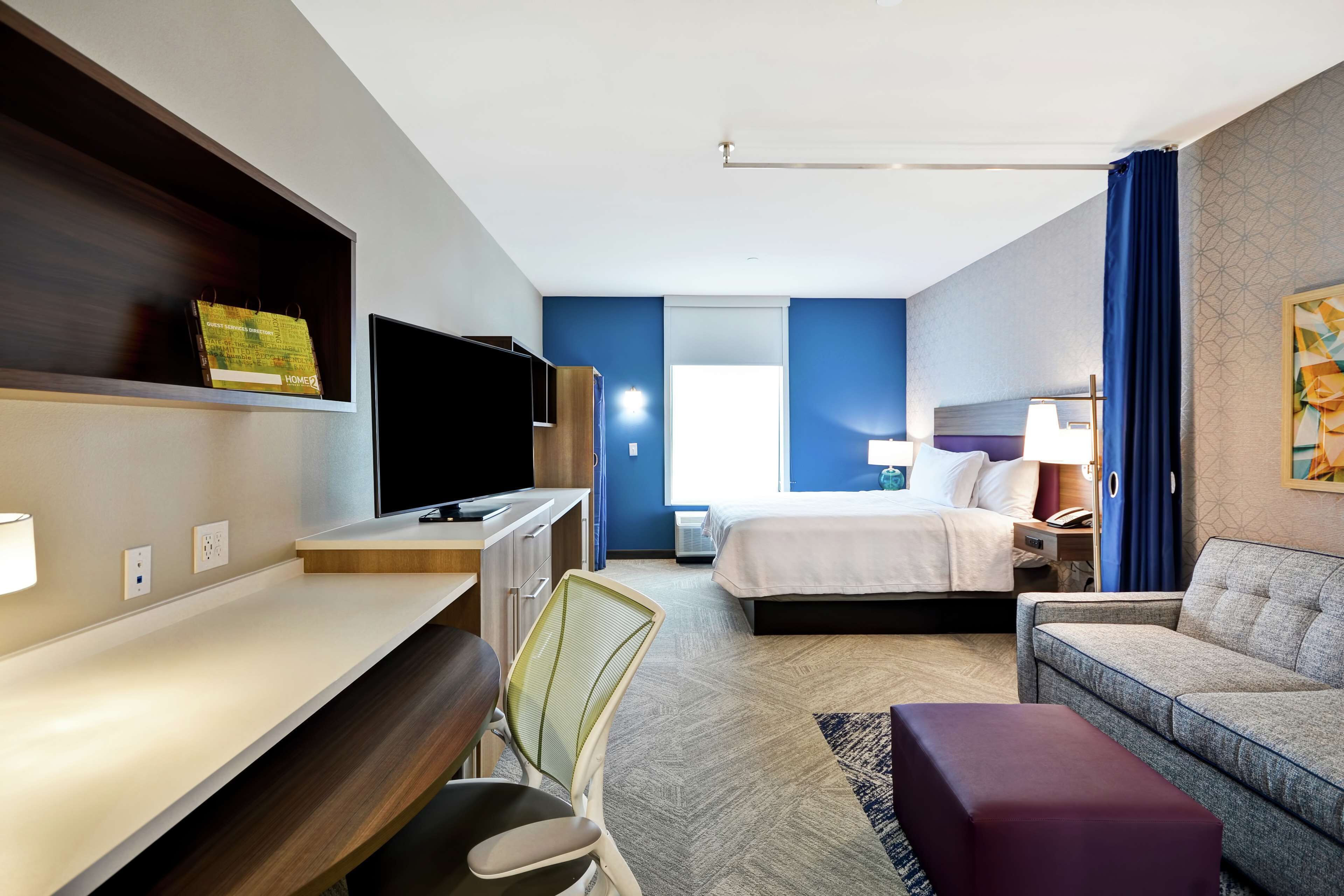 desk, laptop workspace, blackout curtains, iron/ironing board