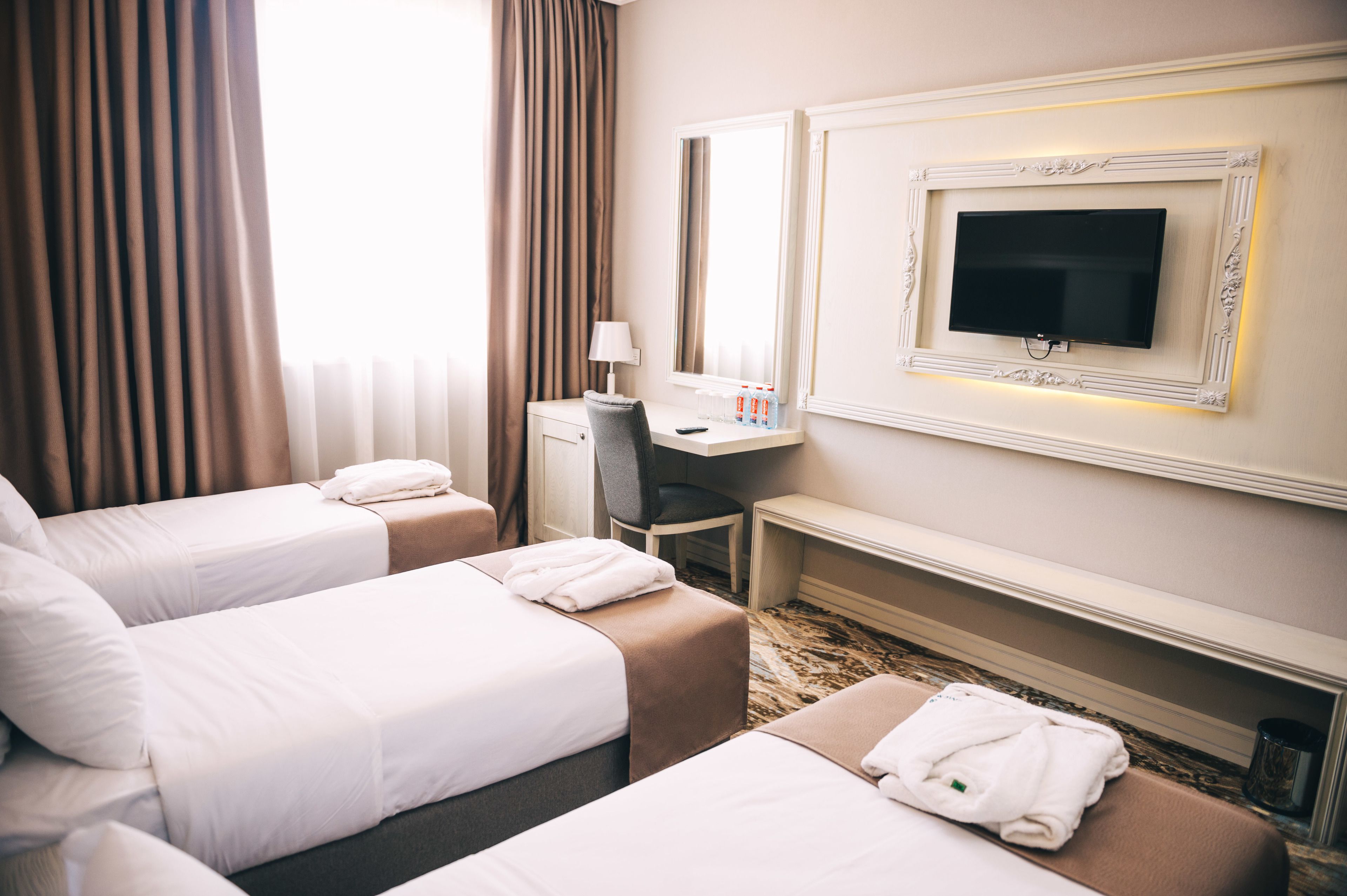 standard triple room | minibar, in-room safe, desk, blackout curtains