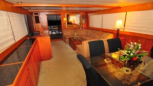 Deluxe Cabin | Living area | Flat-screen TV, DVD player