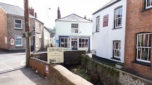 A sign for 'Town Mills' with a traditional building in the background. - Town Mills B &B (Dulverton)