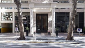 A building with a sign reading "PREMIUM TOWER" and a "P" logo. - Premium Tower Suites (Mendoza)