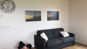 Family Apartment, Multiple Beds, Ocean View | Living room | Smart TV