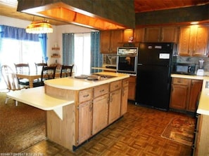 Room | Private kitchen | Fridge, microwave, oven, dishwasher - Celtic Cove Main Cabin (Rangeley)