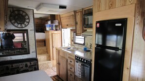 Room | Private kitchen | Coffee/tea maker, fridge, microwave - Uncle Billy Bob's Redneck Trailers Vacation Rentals-Bubba's Glamper #4 - Caravan Park (Garden Valley)