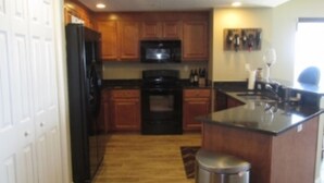 Room | Private kitchen | Coffee/tea maker, fridge, microwave - Northeast Corner - 3 BR 3 BA - Sanibel 1002 (Daytona Beach Shores)