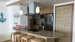 Room | Private kitchen | Coffee/tea maker, fridge, microwave - Beachfront Apartment (Guayacanes)