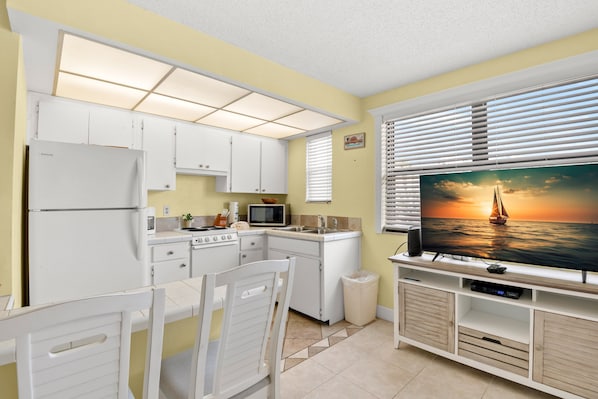 Fridge, microwave, oven, stovetop - 🌅 Gulf Winds 1BR Condo — Sunset Views & King Comfort on the Second Floor (ST PETE BEACH)