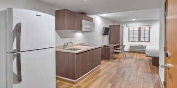 Suite, 1 Queen Bed | Desk, blackout drapes, bed sheets