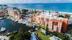 Guests can enjoy scenic ocean views from this coastal hotel, situated near a beach and overlooking a marina with various boats.
