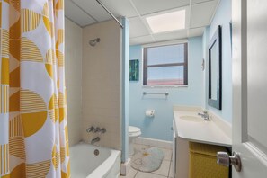 Bathtub, hair dryer, towels
