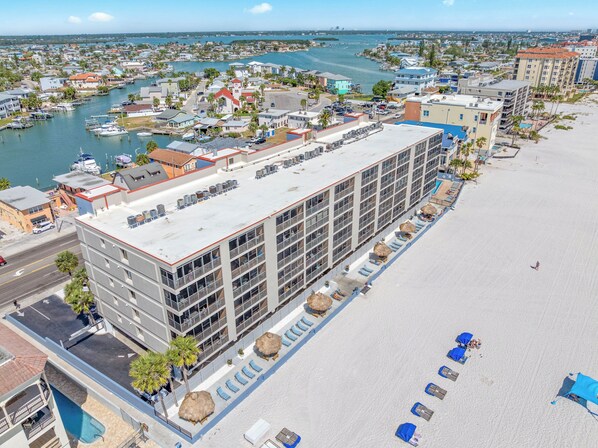 A hotel with a rooftop terrace, a pool, and a beachside location.