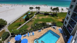 A hotel with a swimming pool, beach view, and a fenced lawn area. - 🌞 Caprice Resort Unit #502 – Renovated Gulf Front Escape for Four Guests (St Pete Beach)