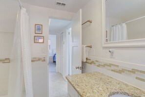 Bathtub, hair dryer, towels