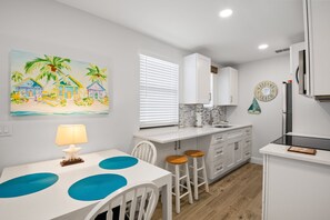 Fridge, microwave, oven, stovetop - 🌴 Gulf Winds #1201 — Spacious Poolside Studio with Beach Views & King Bed (ST PETE BEACH)