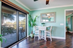 Relax in this serene room with a patio, dining area, and comfortable seating.