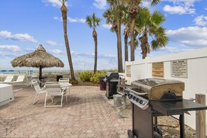 Outdoor dining - Sea Breeze 203 | Spacious Gulf-Front Retreat with Balcony Sunsets (Madeira Beach)