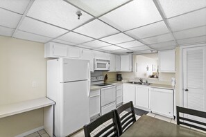 Fridge, microwave, oven, stovetop - Sea Breeze 203 | Spacious Gulf-Front Retreat with Balcony Sunsets (Madeira Beach)