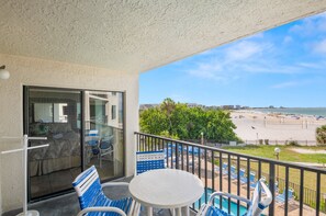 Outdoor dining - 🌅 Caprice Resort Unit #204 – Gulf Front Elegance for Up to Six Guests (St Pete Beach)
