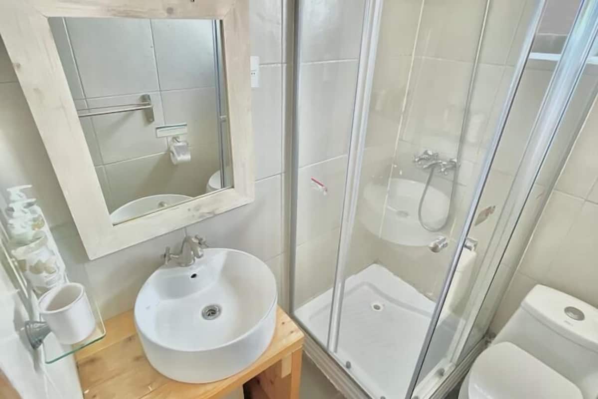 standard quadruple room, hill view | bathroom | shower, free toiletries, hair dryer, towels