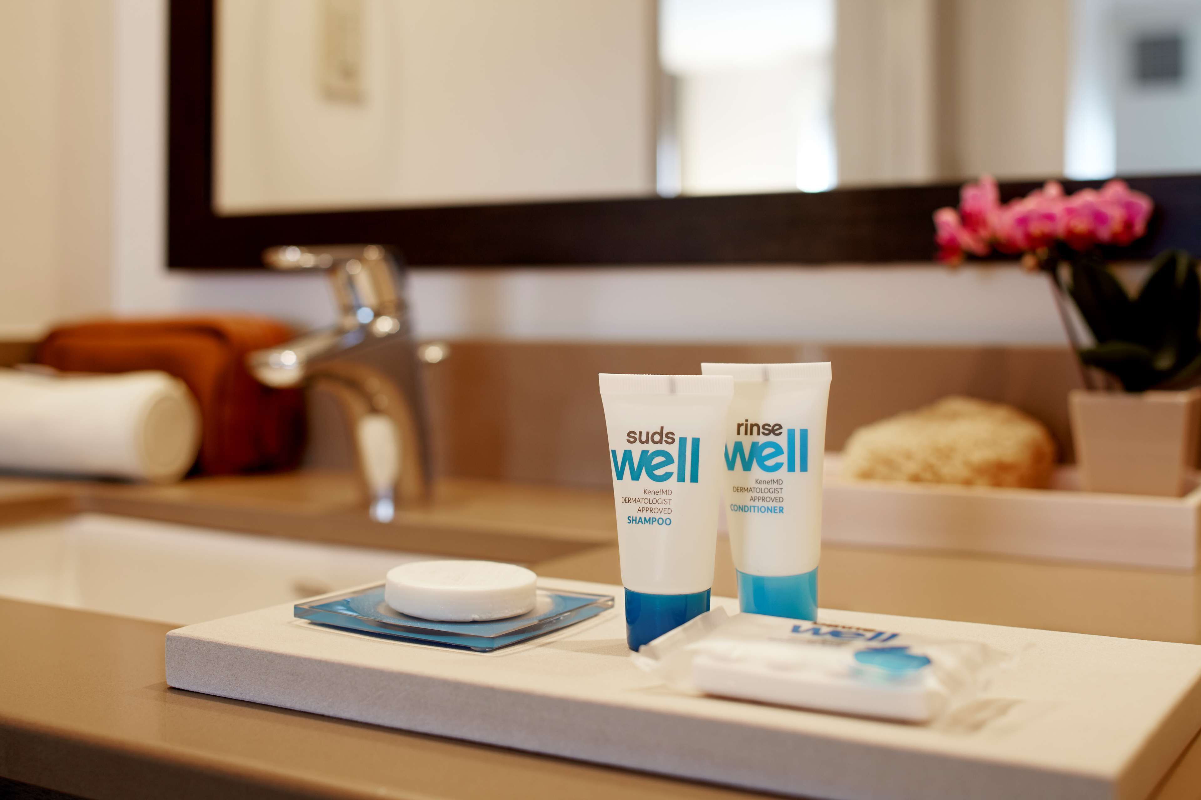 deep-soaking bathtub, hydromassage showerhead, designer toiletries