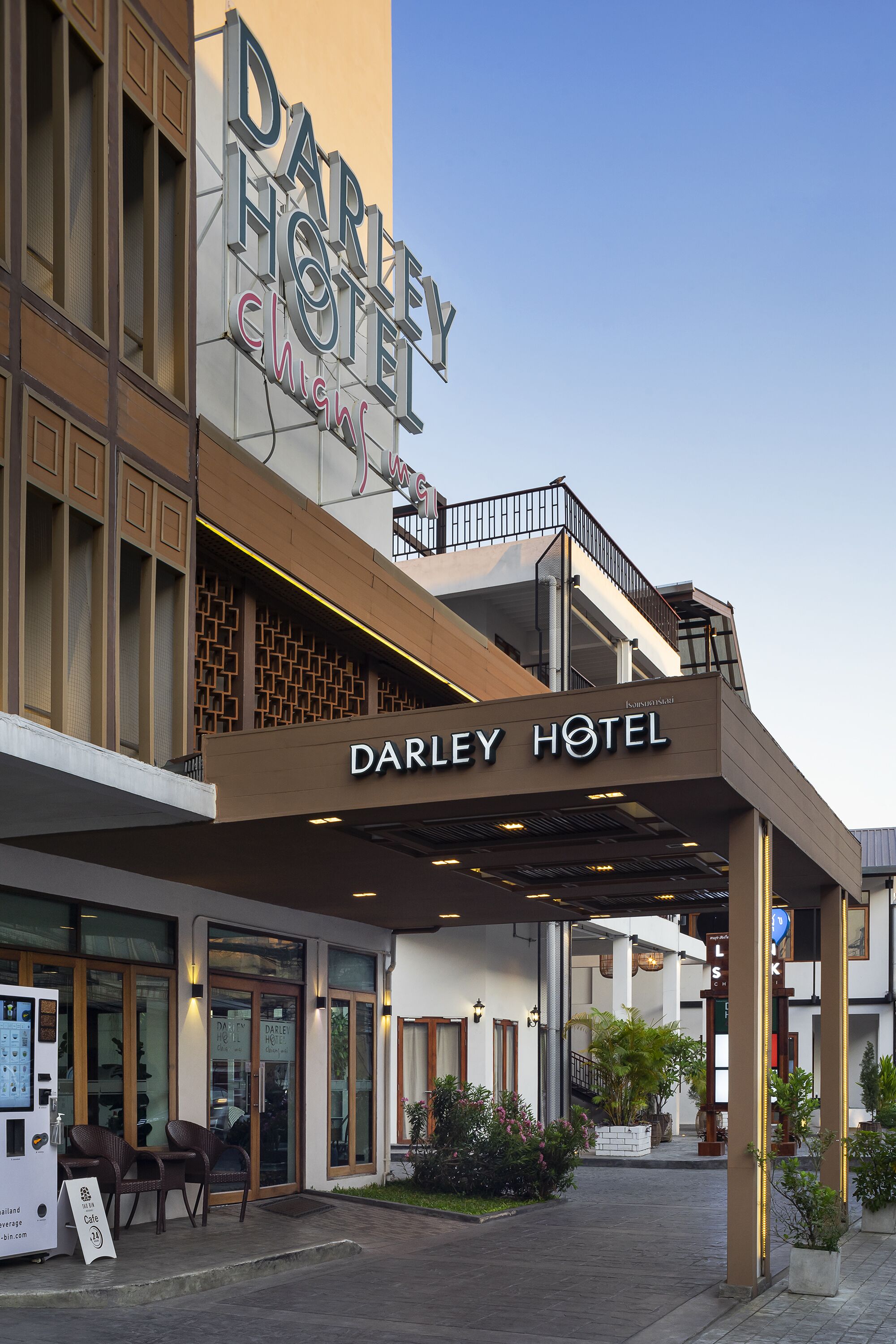 The exterior of Darley Hotel with a modern facade, a covered entrance area, and a sign indicating a 5-star rating.
