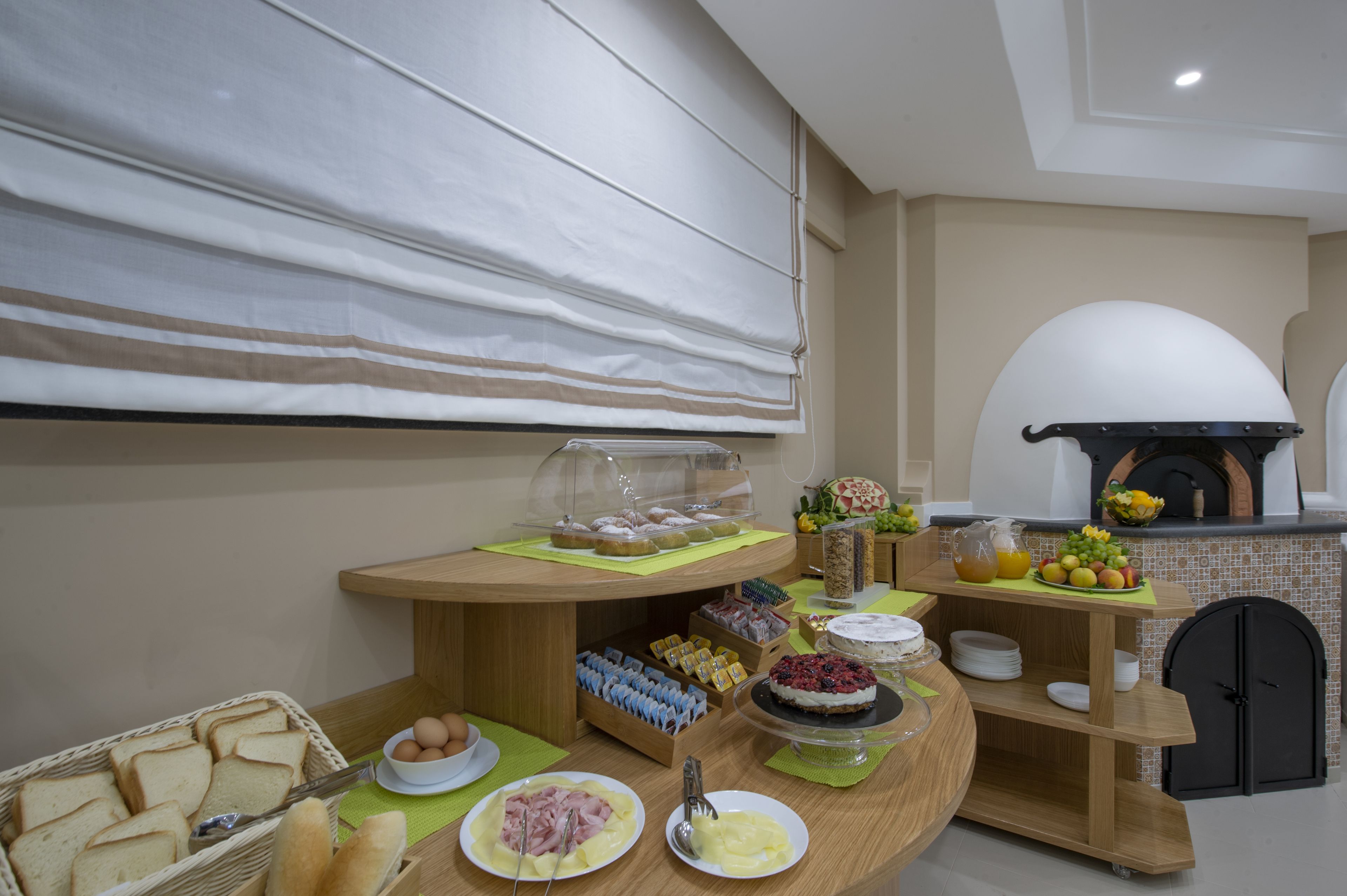 A breakfast buffet with various food items and a coffee station.