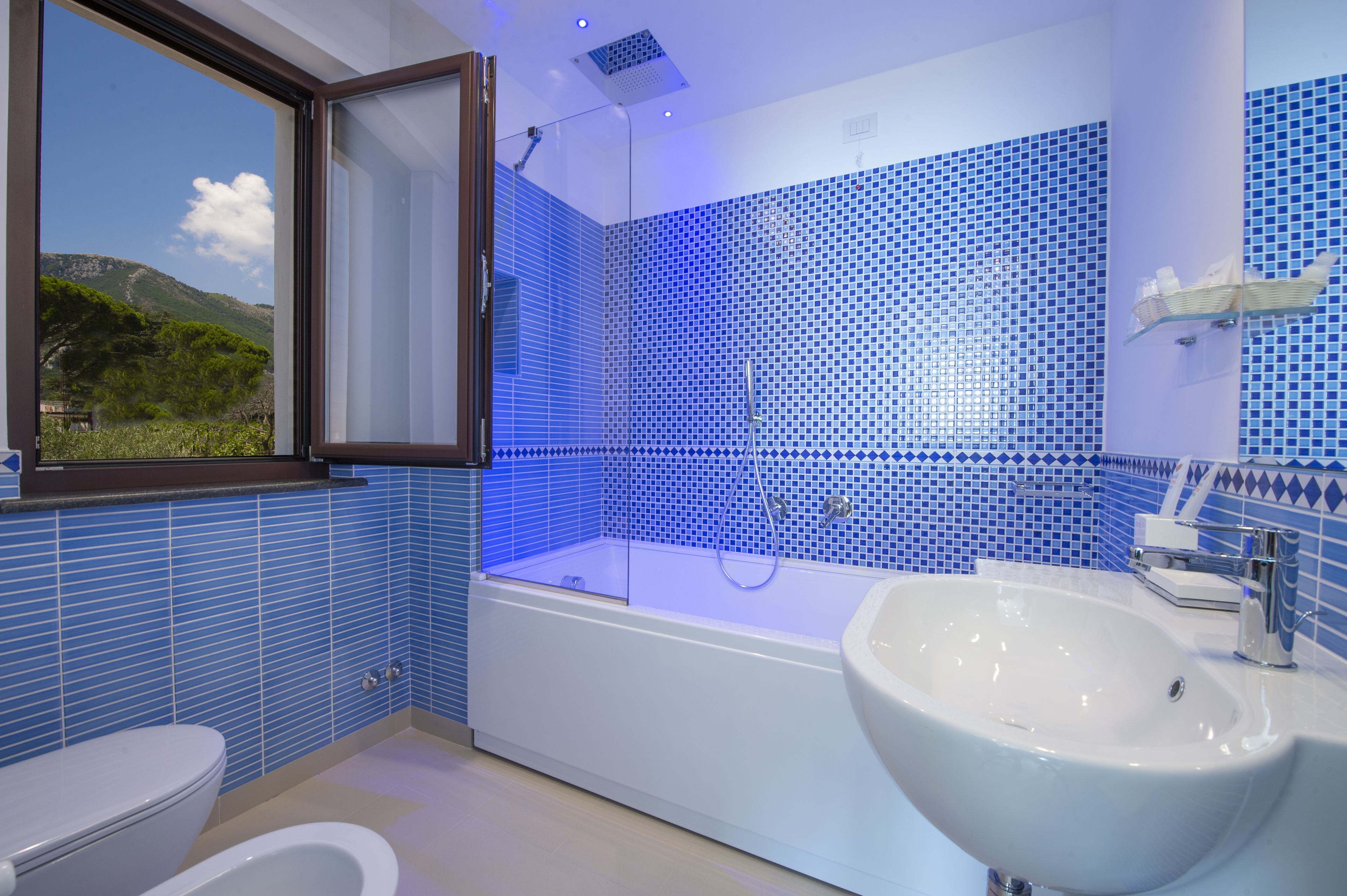 A bathroom with a bathtub, a sink, and a toilet.
