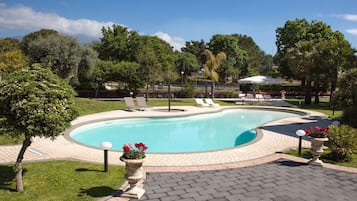 Seasonal outdoor pool, open 9:00 AM to 7:30 PM, pool umbrellas