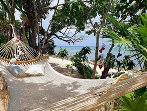 Private beach, white sand, sun loungers, beach umbrellas