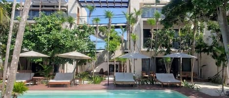 Outdoor pool, open 8 AM to 10 PM, pool umbrellas, pool loungers