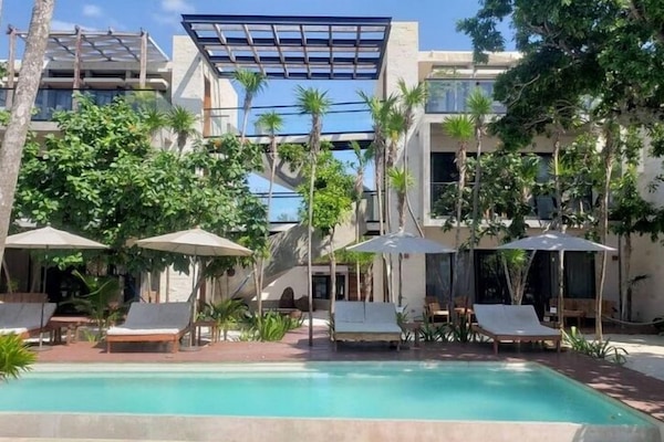 Outdoor pool, open 8 AM to 10 PM, pool umbrellas, pool loungers