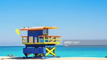On the beach, sun-loungers, beach umbrellas, beach towels