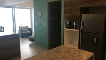 Family Apartment, Multiple Beds | Living area | Flat-screen TV