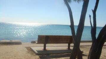 On the beach, sun-loungers, beach towels