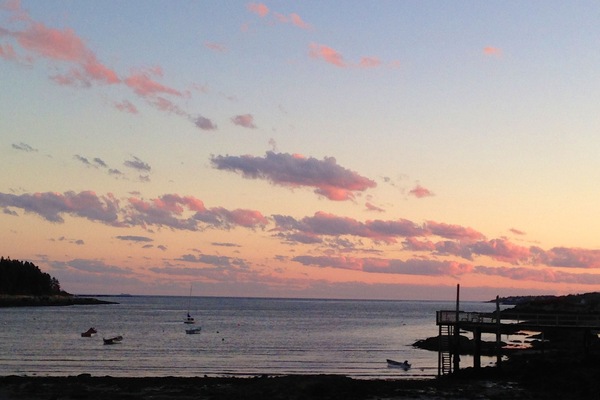 The setting sun on Lowell's Cove & the Atlantic ocean beyond.