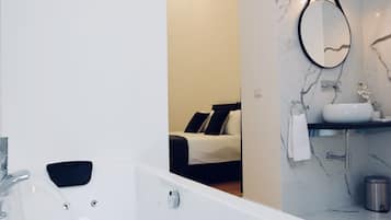 Bathtub, jetted tub, hair dryer, slippers