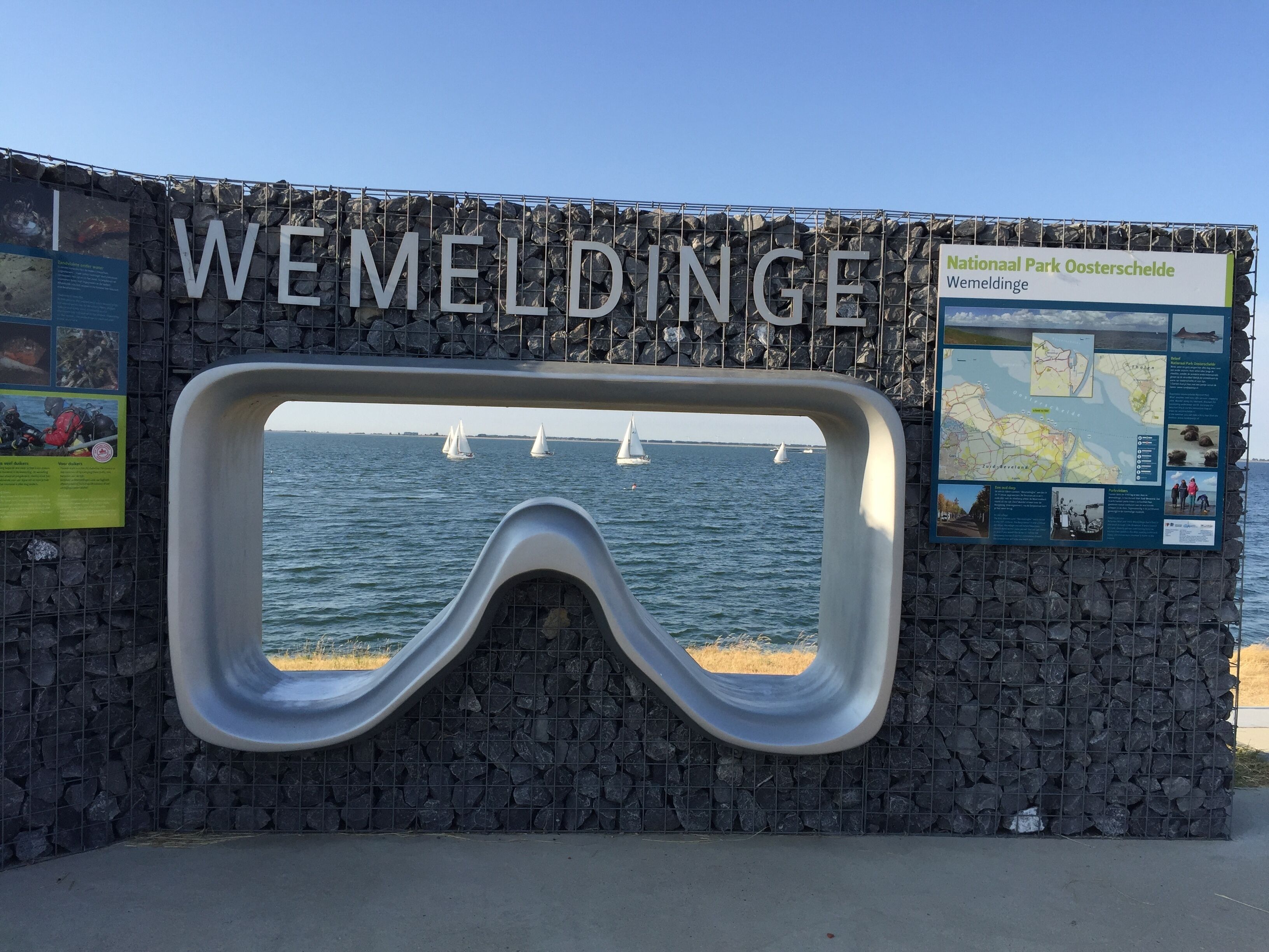 A sign with 'WEMELDINGE' and a map.