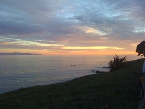 On the beach, sun-loungers