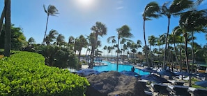 A resort with a pool surrounded by palm trees and lounge chairs. - 4,000+ sq ft beachfront residence + PRIVATE BEACH Resort & Spa by Marriott (Fort Lauderdale)