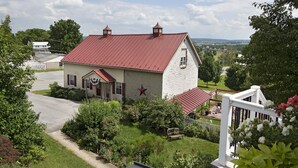 A white building with a red roof, a star on the front, and a white picket fence. - Historic Building, Quiet Location in Beautiful Lancaster County, Stella Side (Terre HIll)