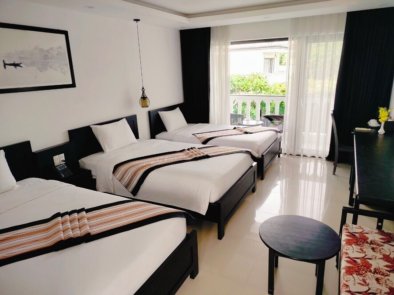 Deluxe Triple Room, Balcony | Minibar, in-room safe, desk, laptop workspace