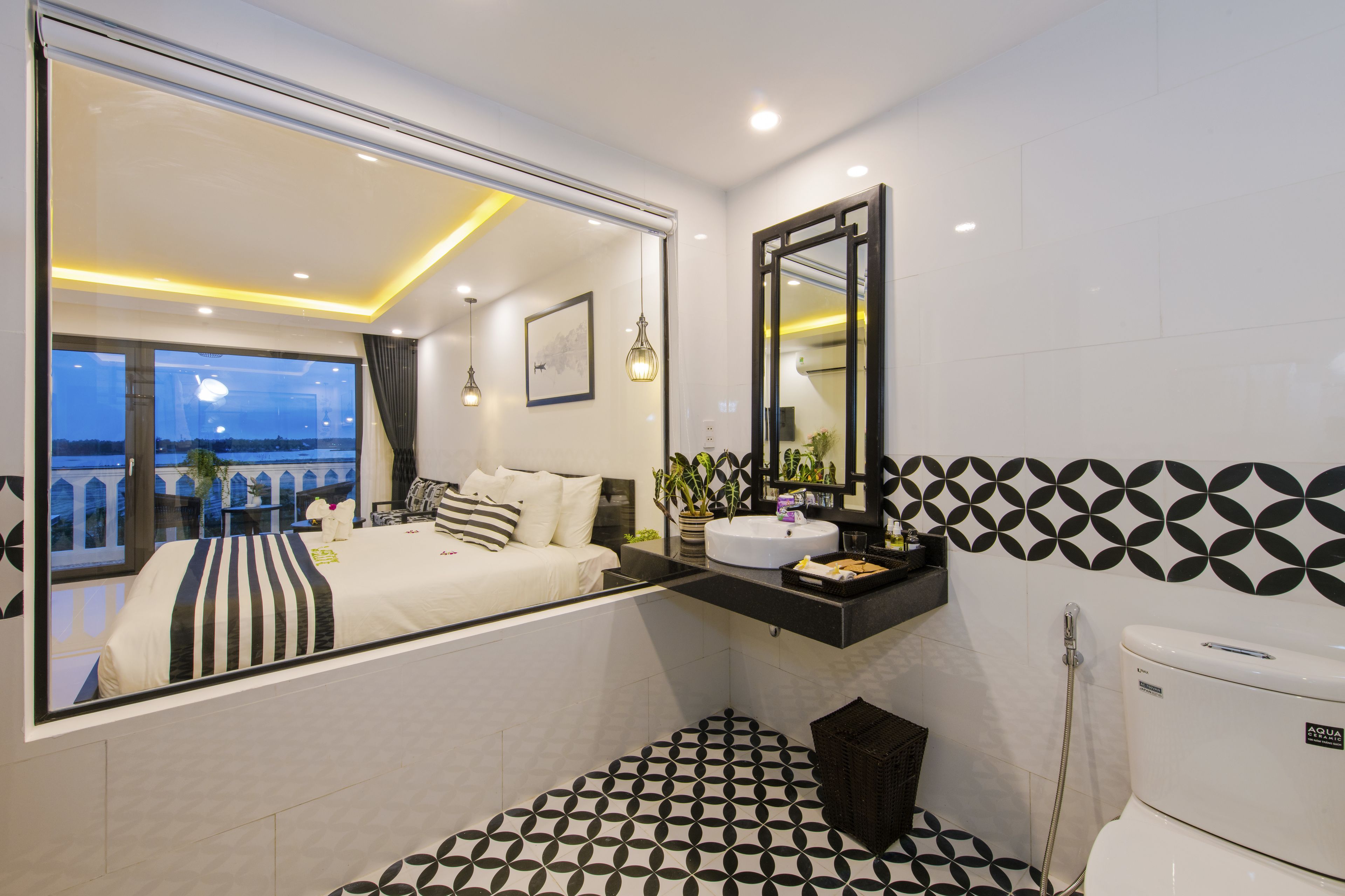 deluxe double or twin room, balcony, river view | minibar, in-room safe, desk, laptop workspace