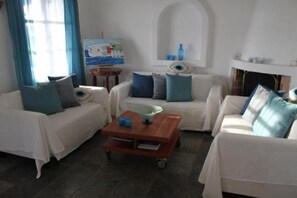 Comfort Villa, 3 Bedrooms | Living room | Flat-screen TV, fireplace - Villa Elena (Mykonos)