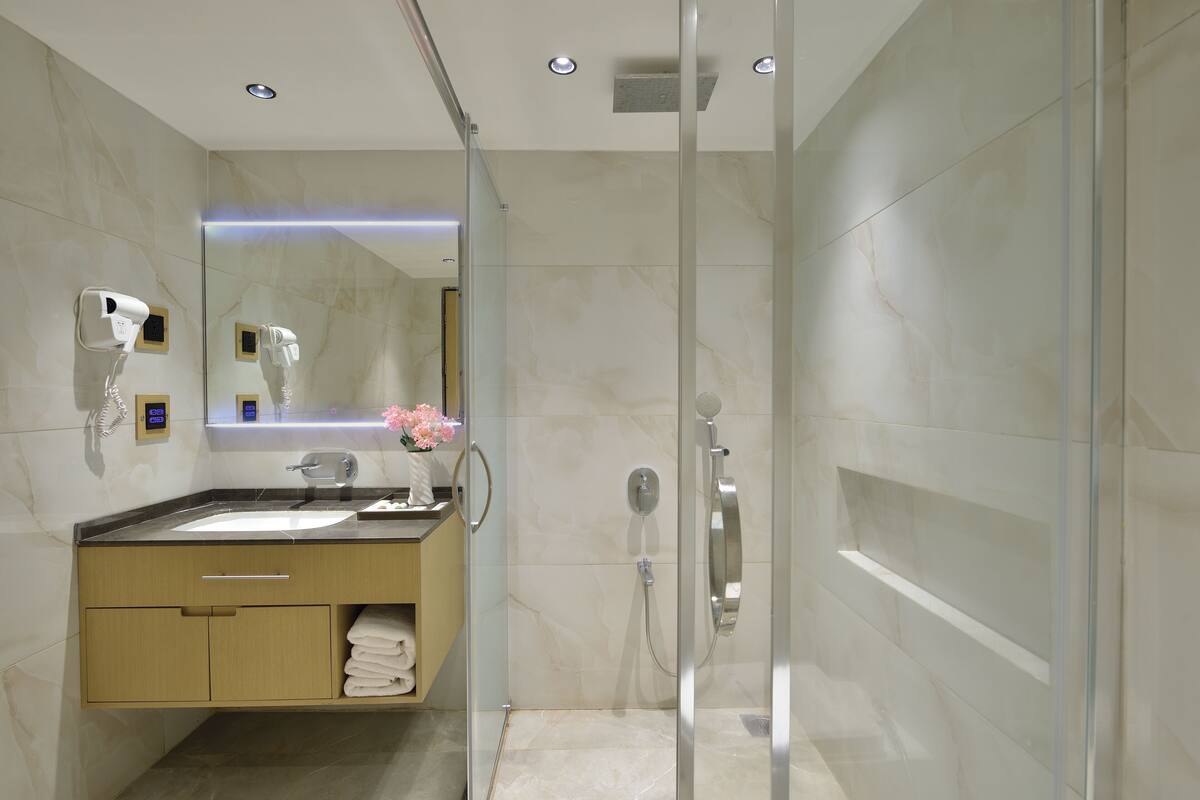 Shower, free toiletries, slippers, towels