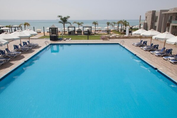 Indoor pool, 3 outdoor pools, open 8 AM to 6 PM, pool umbrellas