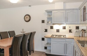Fridge, stovetop, dishwasher, coffee/tea maker