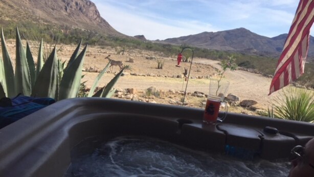 A hot tub with a view of a desert landscape and mountains in the background. - RELAX OFF THE BEATEN PATH! (Terlingua)