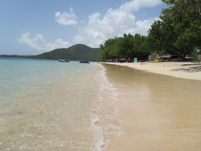 Pretty, old Creole villa with veranda, gazebo and floral garden.