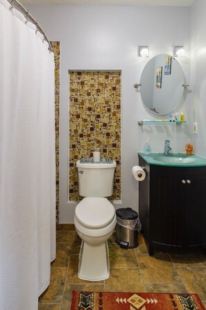 Combined shower/bathtub, hair dryer, towels, toilet paper